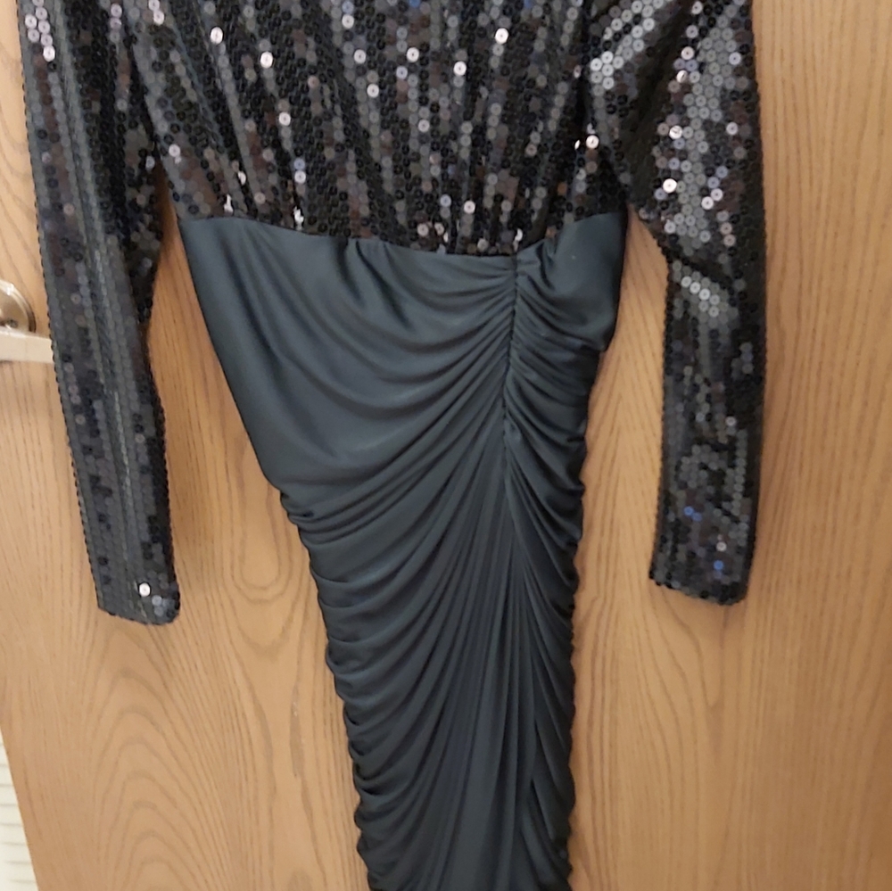 This is a size 6, black sequined mermaid gown